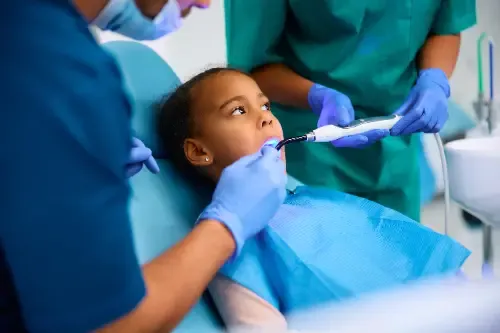 a small girl during a dental procedure