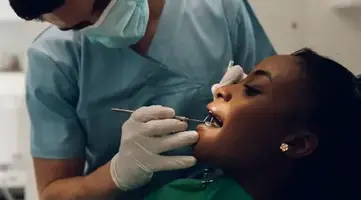Dentist providing preventive dental care